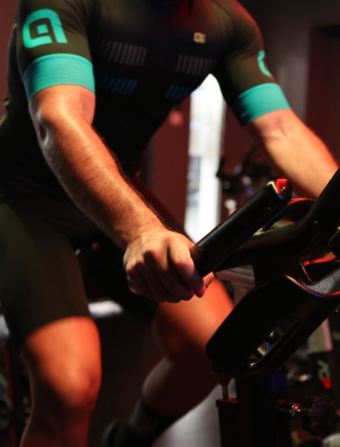 Holmes Place | man riding a stationary bike